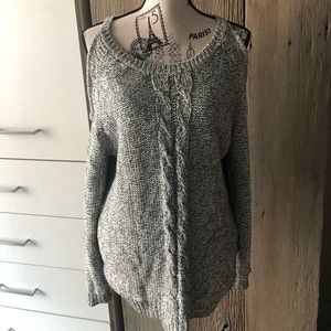 Knit sweater with shoulder cut out
